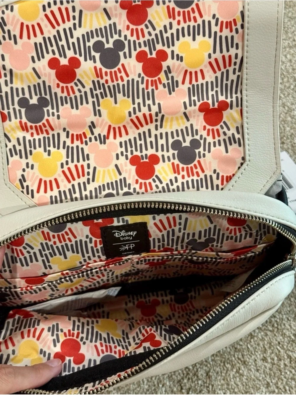 Freshly Picked Cream Baby Bag with Black-Trim Mickey Detail and Multicolor Strap